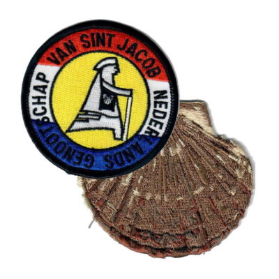 schelp met badge van het Genootschap